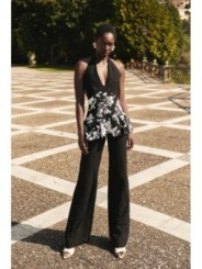 top troquelado negro con lentejuelas blancas y volante