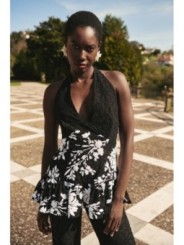 top troquelado negro con lentejuelas blancas y volante