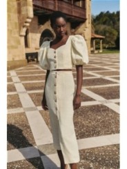 Top manga abullonada joya chanel blanco roto