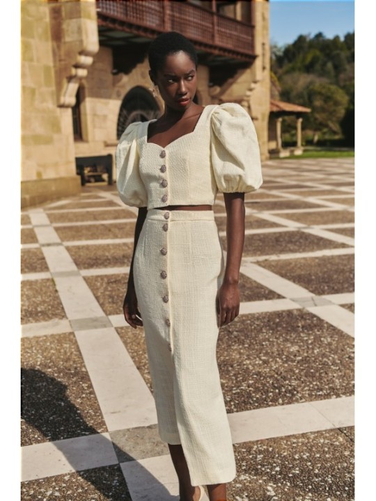 Top manga abullonada joya chanel blanco roto