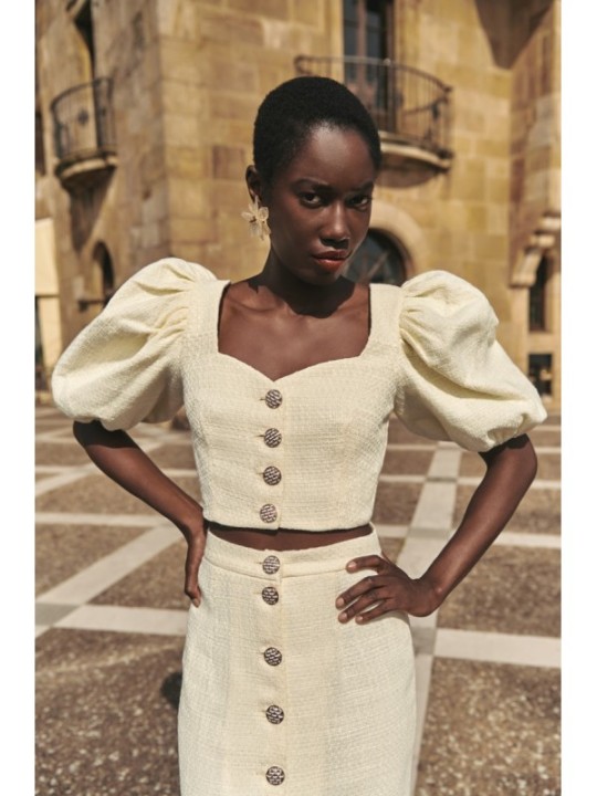 Top manga abullonada joya chanel blanco roto