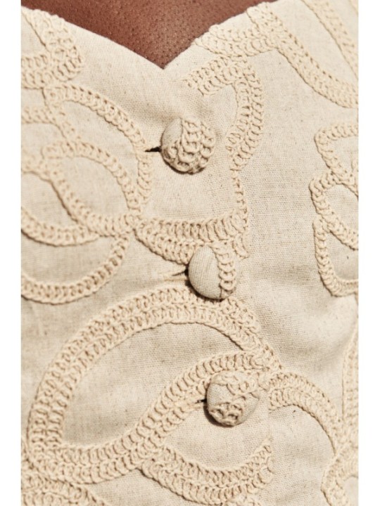 top  lino beige con dibujo relieve para invitadas