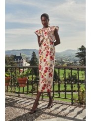 vestido con volantes y falda midi de lino bordado flores para invitadas