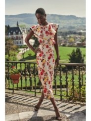 vestido con volantes y falda midi de lino bordado flores para invitadas