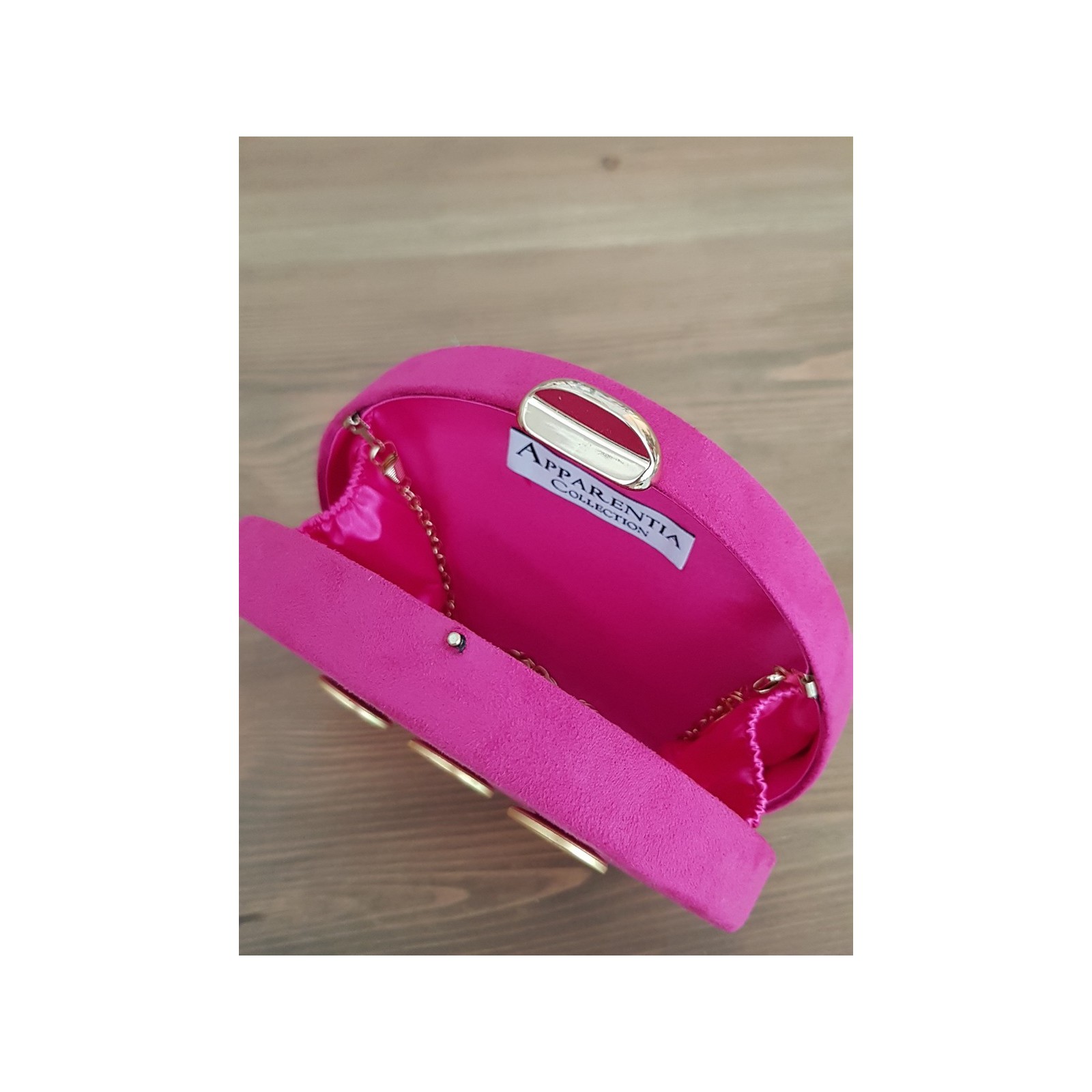 bolso de fiesta de ante rosa fucsia con botones dorados