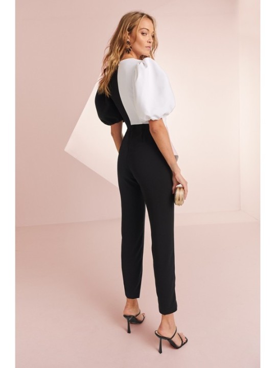 Mono de fiesta de crepe negro y blanco con manga larga abullonada