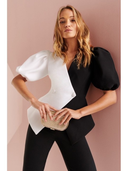 Mono de fiesta de crepe negro y blanco con manga larga abullonada